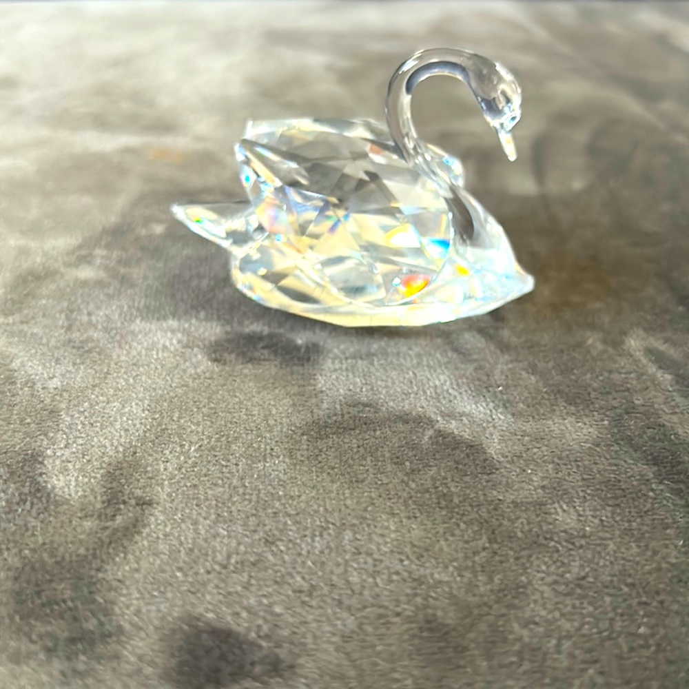 Swarovski crystal swan never displayed. Comes with box and certificate